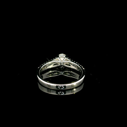 Round diamond split shank engagement ring in 18K white gold with diamond-set band