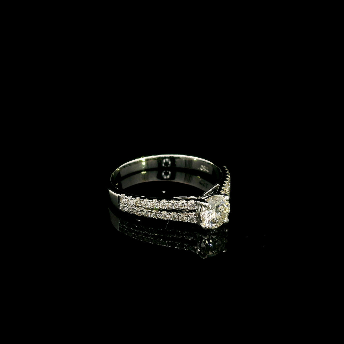 Round diamond split shank engagement ring in 18K white gold with diamond-set band