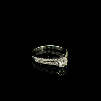 Round diamond split shank engagement ring in 18K white gold with diamond-set band