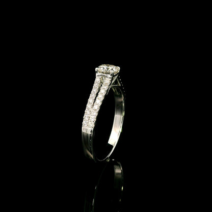 Round diamond split shank engagement ring in 18K white gold with diamond-set band