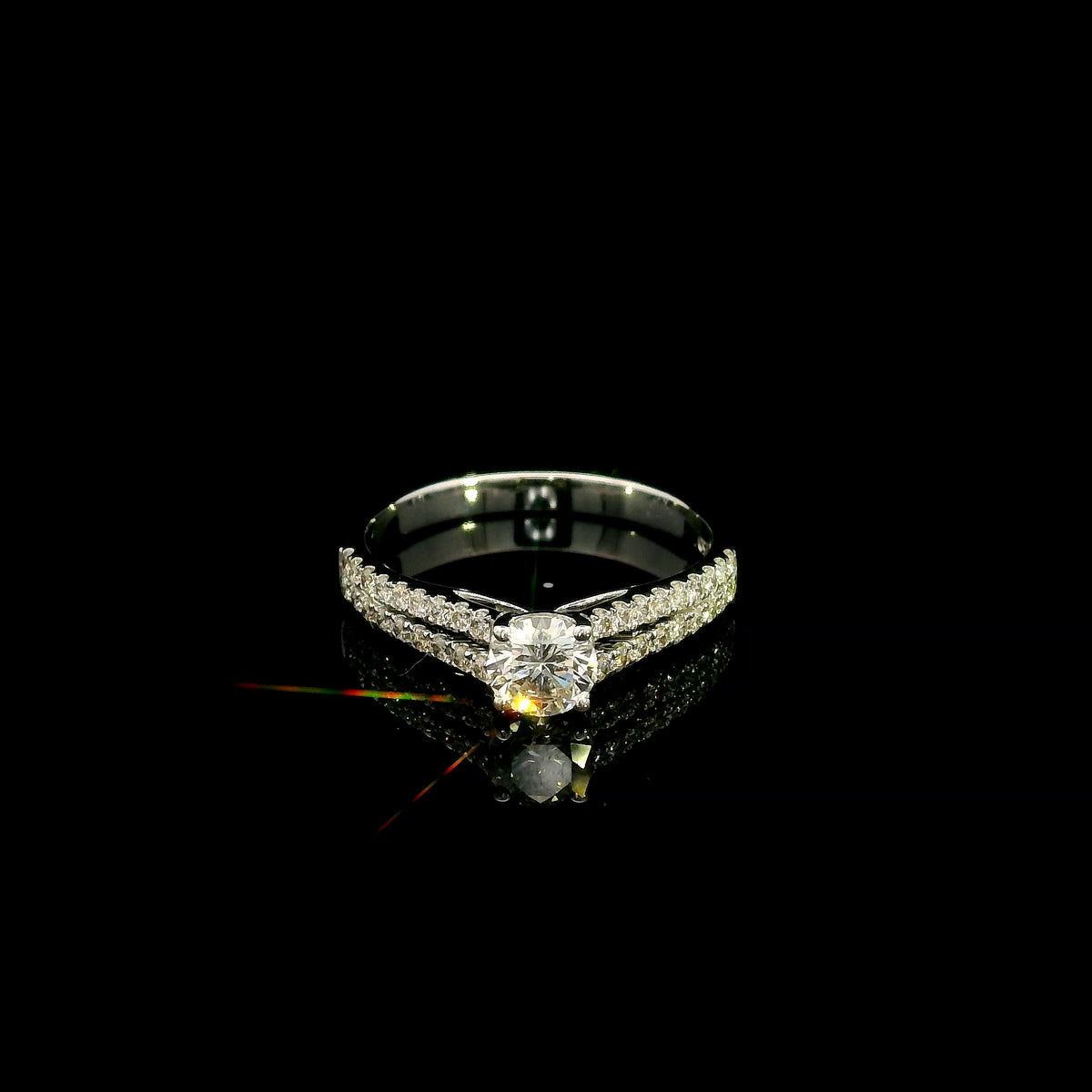Round diamond split shank engagement ring in 18K white gold with diamond-set band