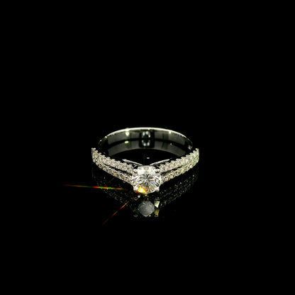 Round diamond split shank engagement ring in 18K white gold with diamond-set band