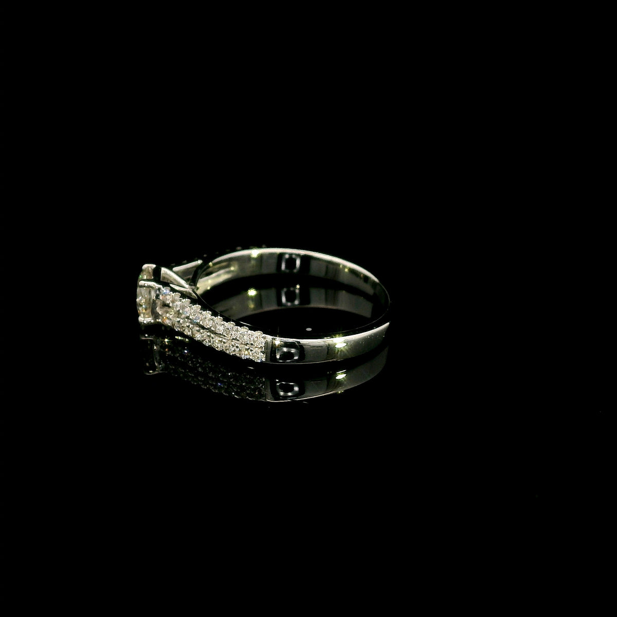 Round diamond split shank engagement ring in 18K white gold with diamond-set band