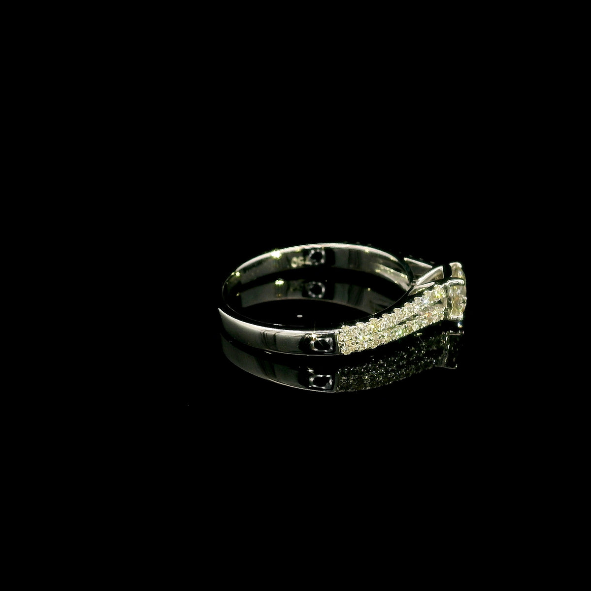 Round diamond split shank engagement ring in 18K white gold with diamond-set band