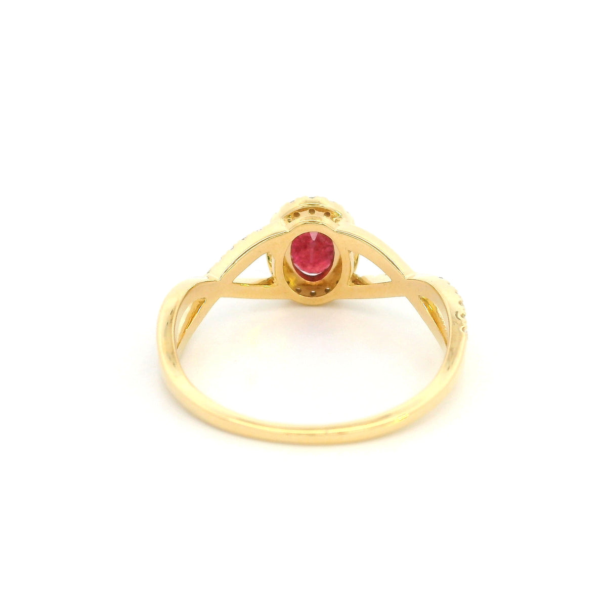 Ruby and diamond ring in 18K yellow gold with oval ruby, diamond halo and crossover band