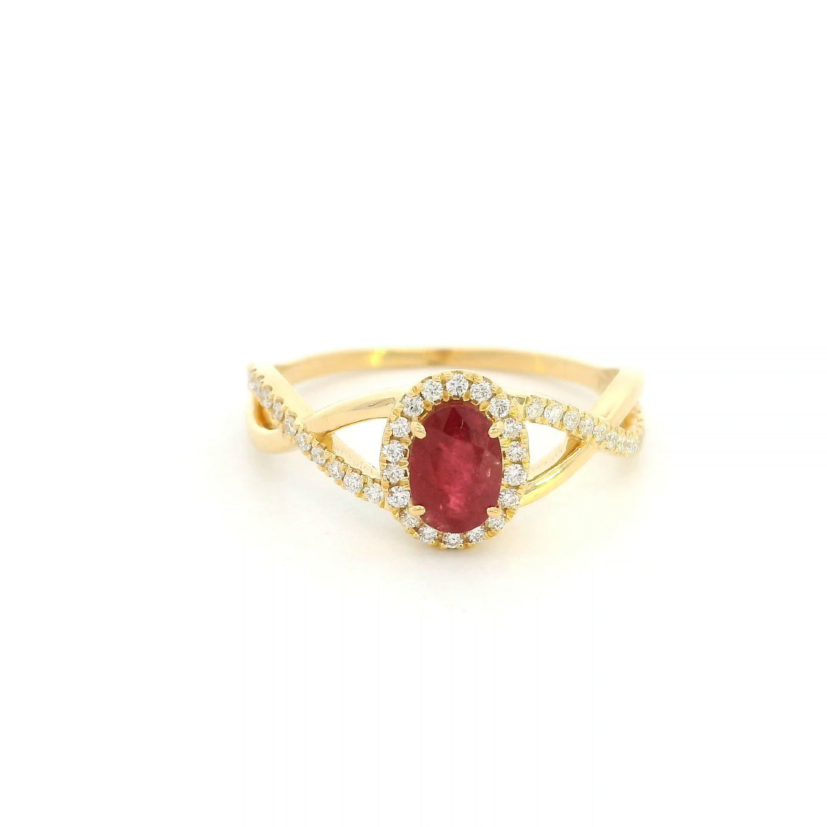 Ruby and diamond ring in 18K yellow gold with oval ruby, diamond halo and crossover band