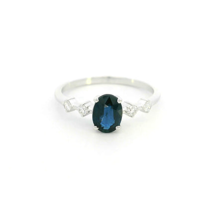Oval blue sapphire diamond ring in 18K white gold with round diamond side stones