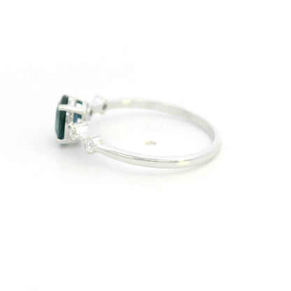 Oval blue sapphire diamond ring in 18K white gold with round diamond side stones