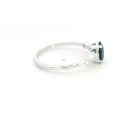 Oval blue sapphire diamond ring in 18K white gold with round diamond side stones