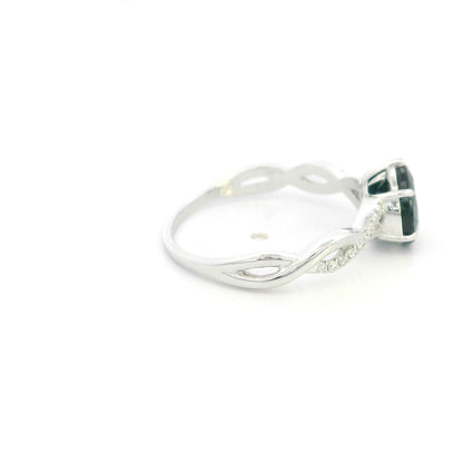 Pear shaped blue sapphire and diamond twist ring in 18K white gold