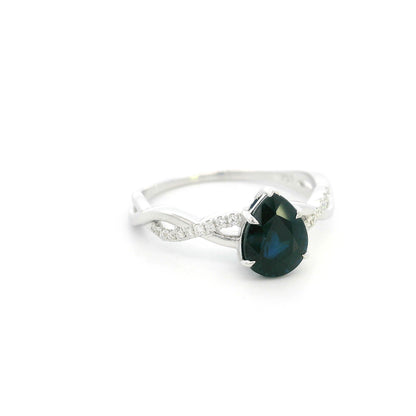 Pear shaped blue sapphire and diamond twist ring in 18K white gold