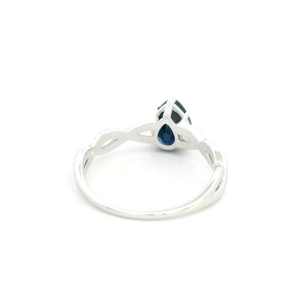 Pear shaped blue sapphire and diamond twist ring in 18K white gold