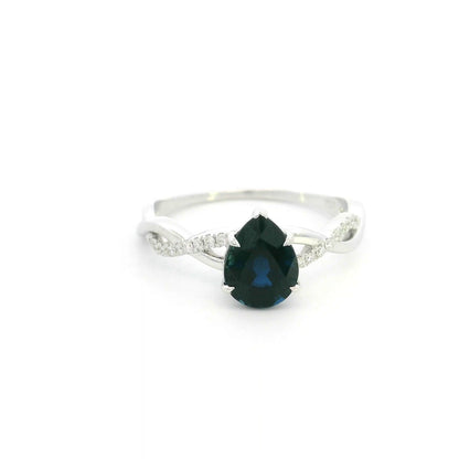 Pear shaped blue sapphire and diamond twist ring in 18K white gold
