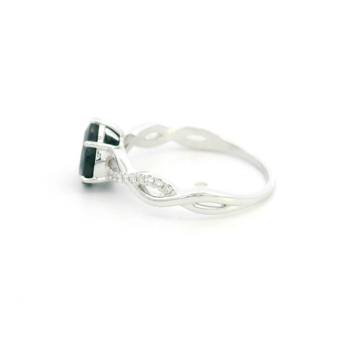 Pear shaped blue sapphire and diamond twist ring in 18K white gold
