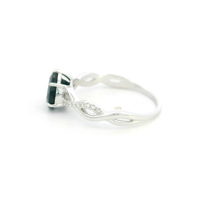 Pear shaped blue sapphire and diamond twist ring in 18K white gold