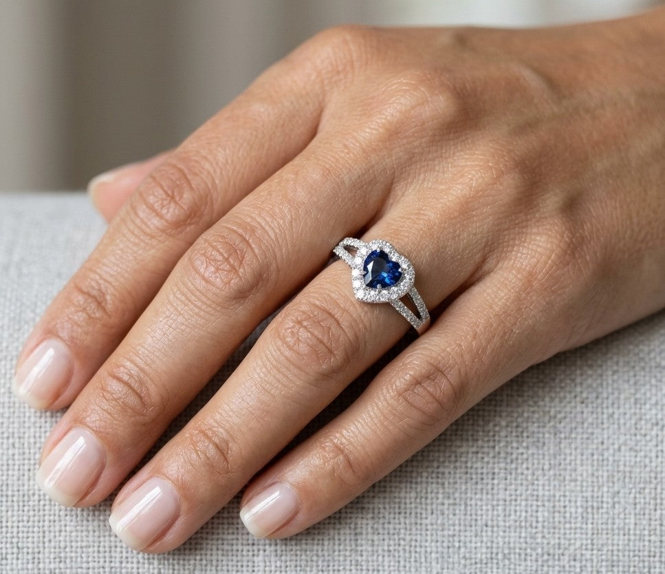Heart shaped blue sapphire and diamond ring in 18K white gold with diamond split band