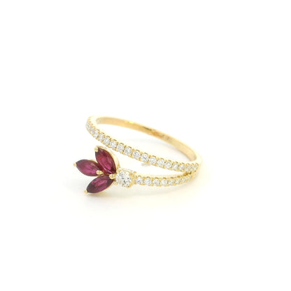 Ruby and diamond floral ring in 18K yellow gold with three marquise shaped rubies and sweeping diamond-set bands.