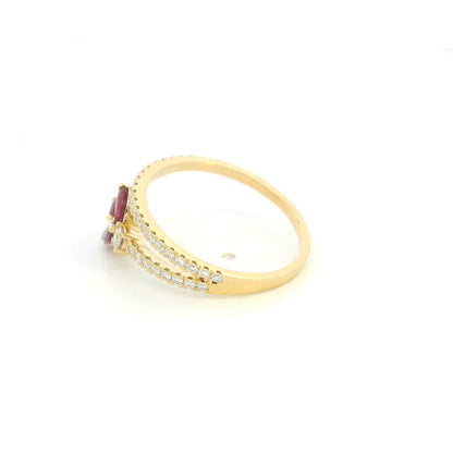 Ruby and diamond floral ring in 18K yellow gold with three marquise shaped rubies and sweeping diamond-set bands.