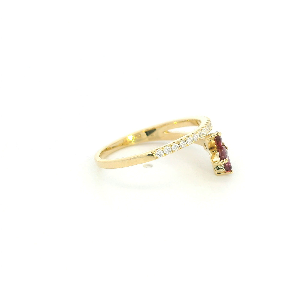 Ruby and diamond floral ring in 18K yellow gold with three marquise shaped rubies and sweeping diamond-set bands.