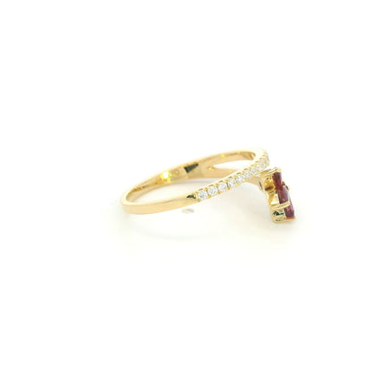 Ruby and diamond floral ring in 18K yellow gold with three marquise shaped rubies and sweeping diamond-set bands.