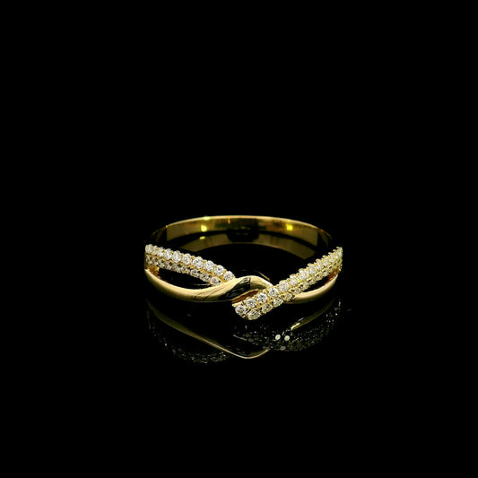 Diamond crossover ring in 18K yellow gold with polished and pavé diamond twist design