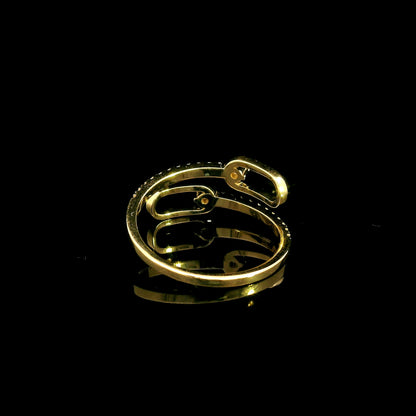 Diamond open bypass ring in 18K yellow gold with round diamonds, sweeping diamond-set curves and polished gold loops.