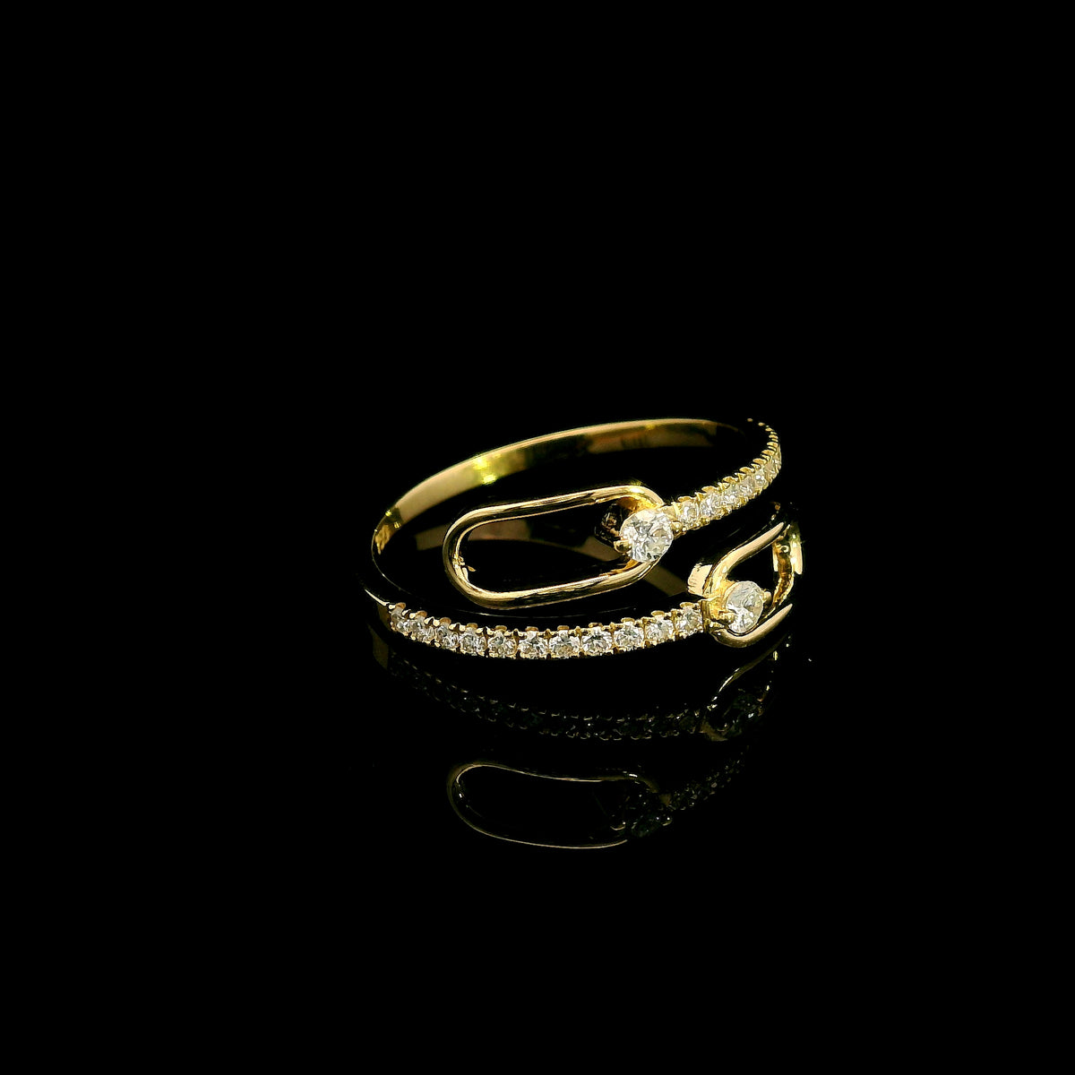 Diamond open bypass ring in 18K yellow gold with round diamonds, sweeping diamond-set curves and polished gold loops.
