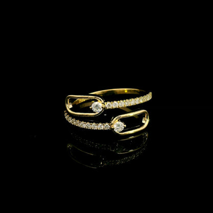 Diamond open bypass ring in 18K yellow gold with round diamonds, sweeping diamond-set curves and polished gold loops.