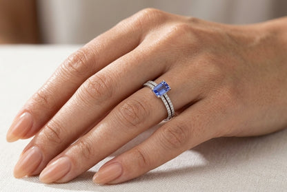 Tanzanite bridal set in 18K white gold with emerald cut tanzanite engagement ring and diamond wedding band