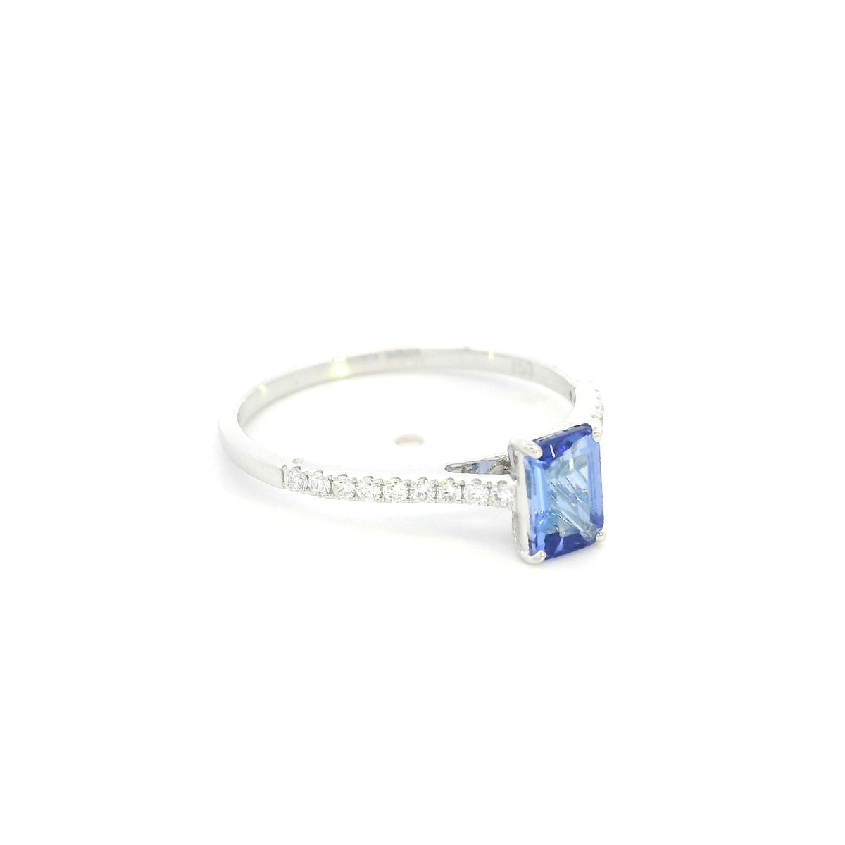 Tanzanite bridal set in 18K white gold with emerald cut tanzanite engagement ring and diamond wedding band