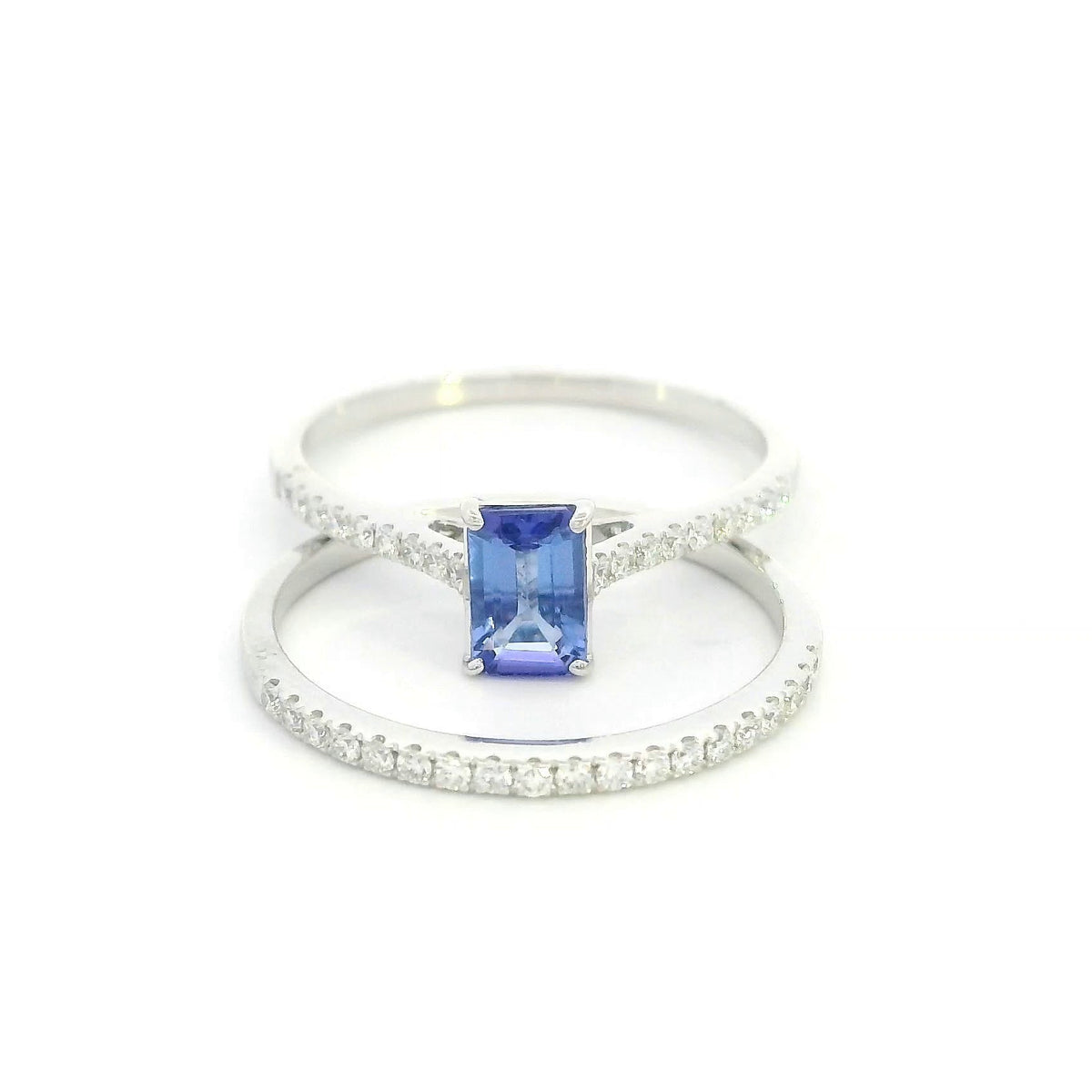 Tanzanite bridal set in 18K white gold with emerald cut tanzanite engagement ring and diamond wedding band