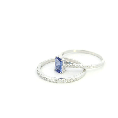 Tanzanite bridal set in 18K white gold with emerald cut tanzanite engagement ring and diamond wedding band