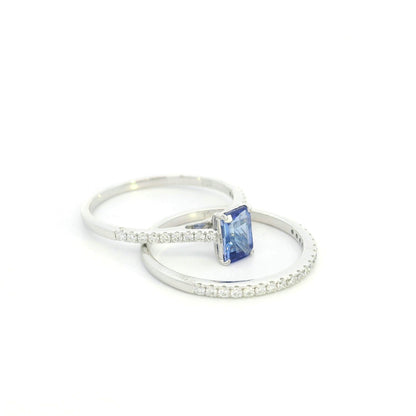 Tanzanite bridal set in 18K white gold with emerald cut tanzanite engagement ring and diamond wedding band