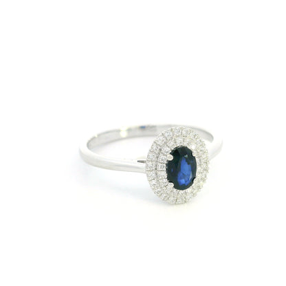 Oval blue sapphire double diamond halo ring in 18K white gold by Emirates Diamonds