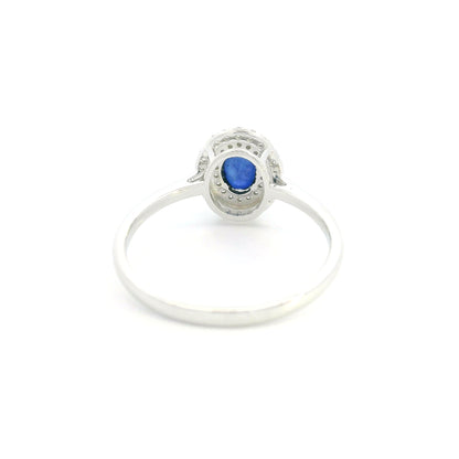Oval blue sapphire double diamond halo ring in 18K white gold by Emirates Diamonds
