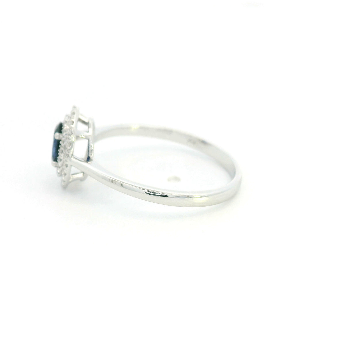 Oval blue sapphire double diamond halo ring in 18K white gold by Emirates Diamonds
