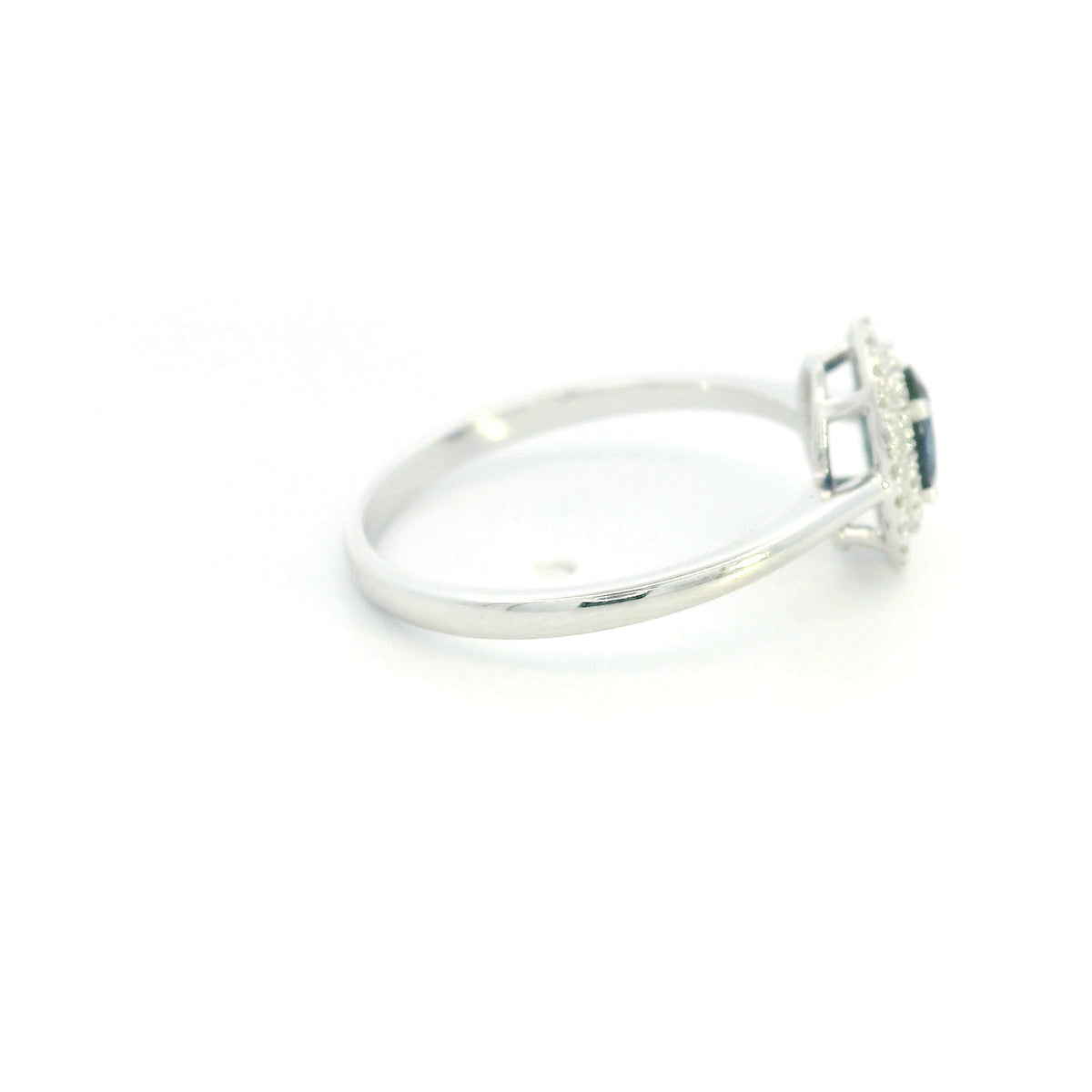 Oval blue sapphire double diamond halo ring in 18K white gold by Emirates Diamonds