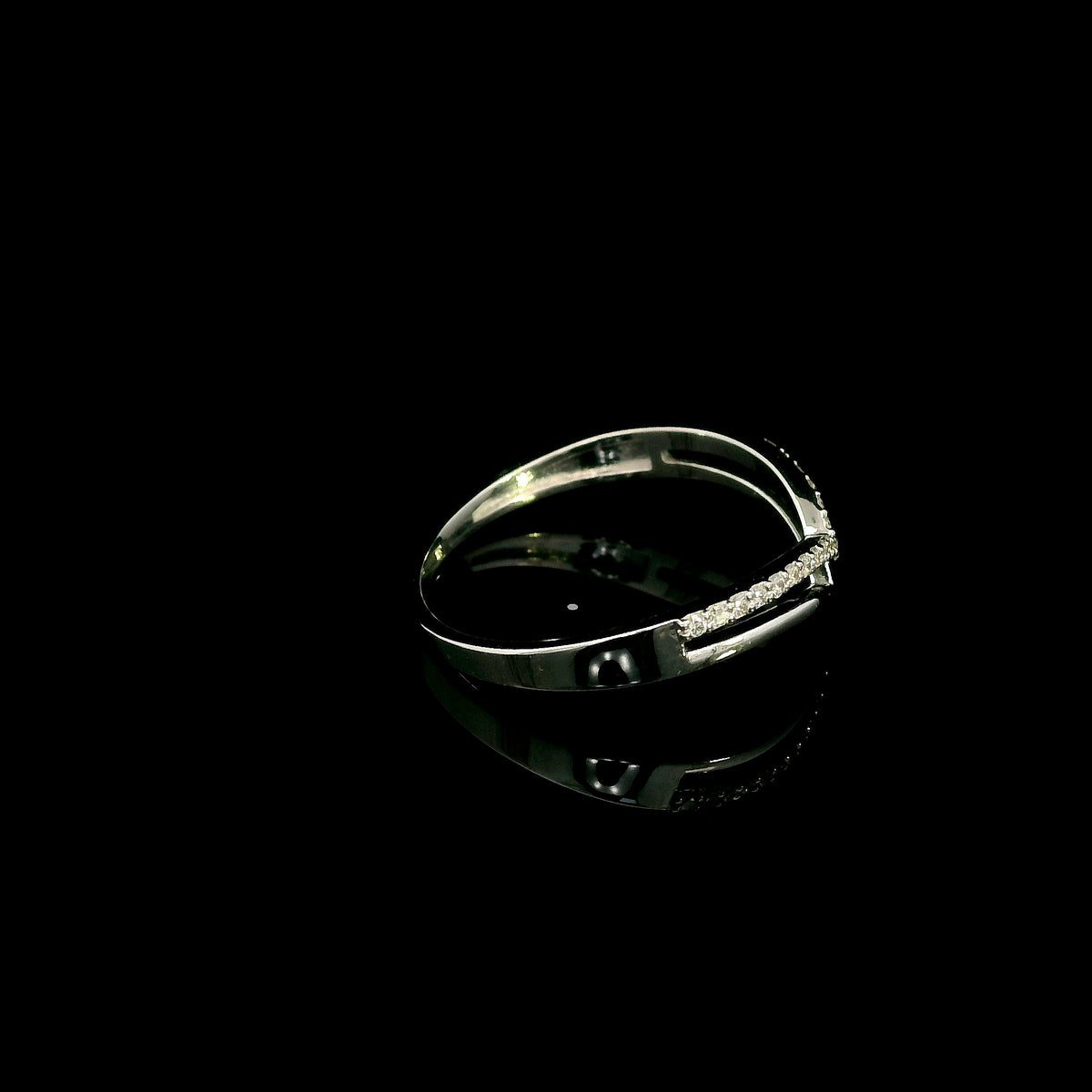 18K white gold diamond chevron wedding band with a layered polished and diamond-set V-shaped design by Emirates Diamonds.