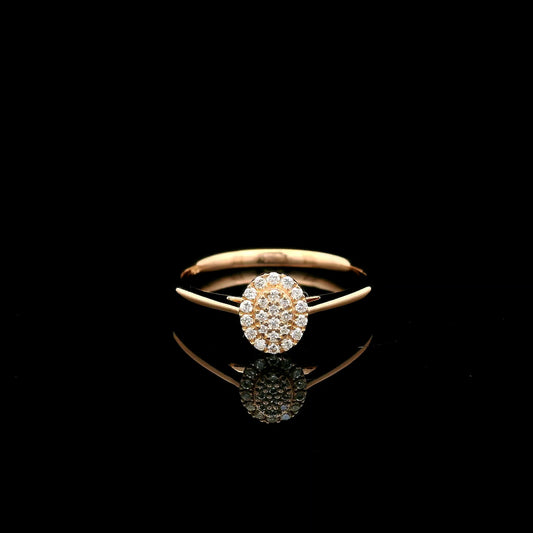 Oval diamond cluster ring in 18K rose gold with round diamonds and a slim polished band.
