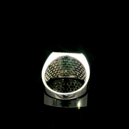 Men’s emerald and diamond statement ring in 18K white gold with rectangular green emerald and diamond surround.
