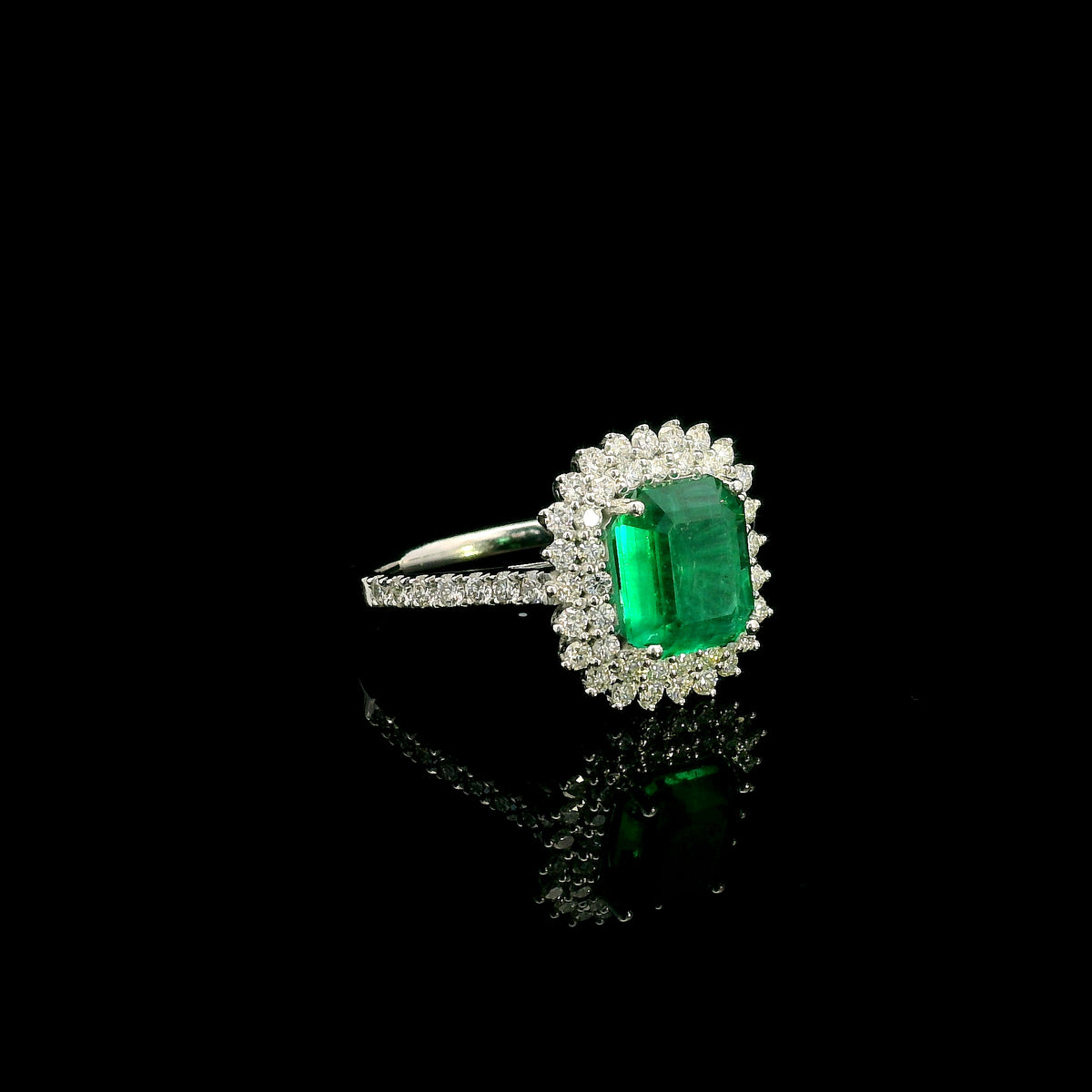 Emerald and Diamond Halo Ring in 18K White Gold
