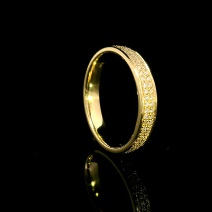 Double row diamond band ring in 18K yellow gold featuring two rows of round diamonds framed by polished gold edges.