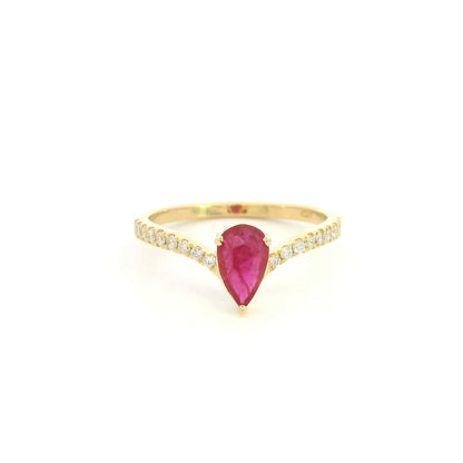 Pear shaped ruby and diamond ring in 18K yellow gold with diamond set shoulders