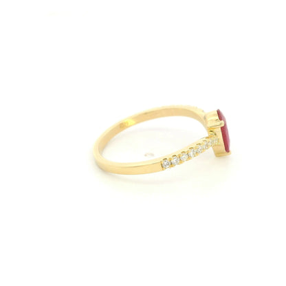 Pear shaped ruby and diamond ring in 18K yellow gold with diamond set shoulders