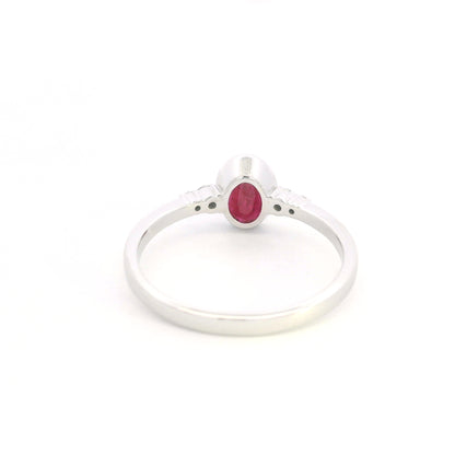 Oval ruby and diamond ring in 18K white gold
