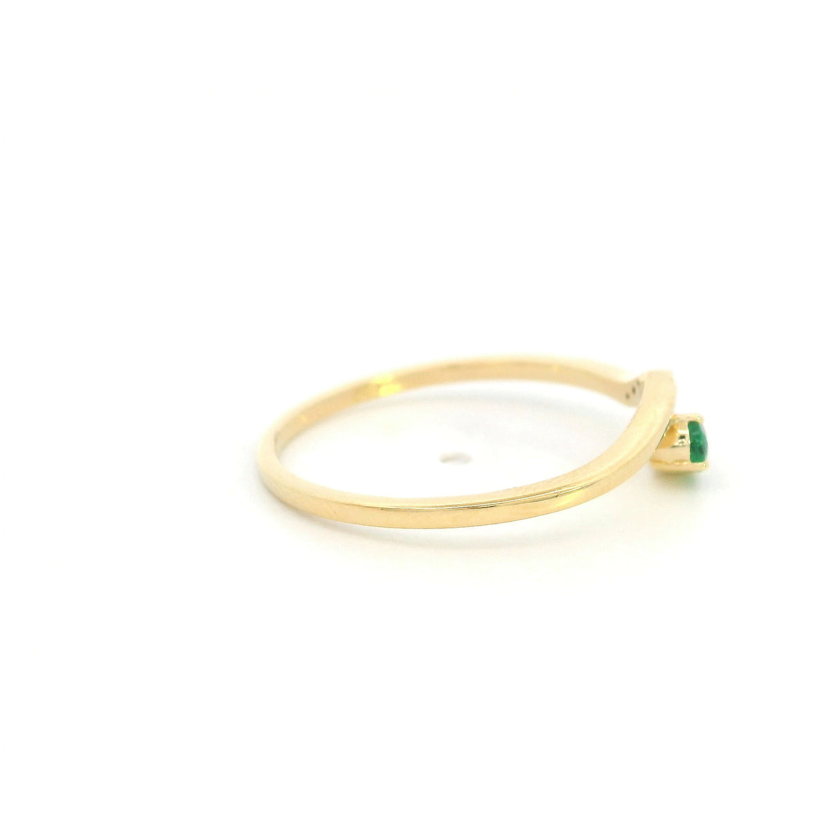 Dainty emerald and diamond ring in 18K yellow gold with curved asymmetrical design