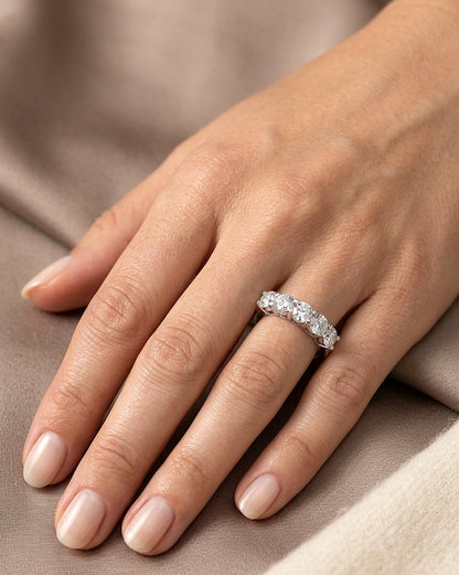 Five stone diamond band ring in 18K white gold with round brilliant diamonds set across the front