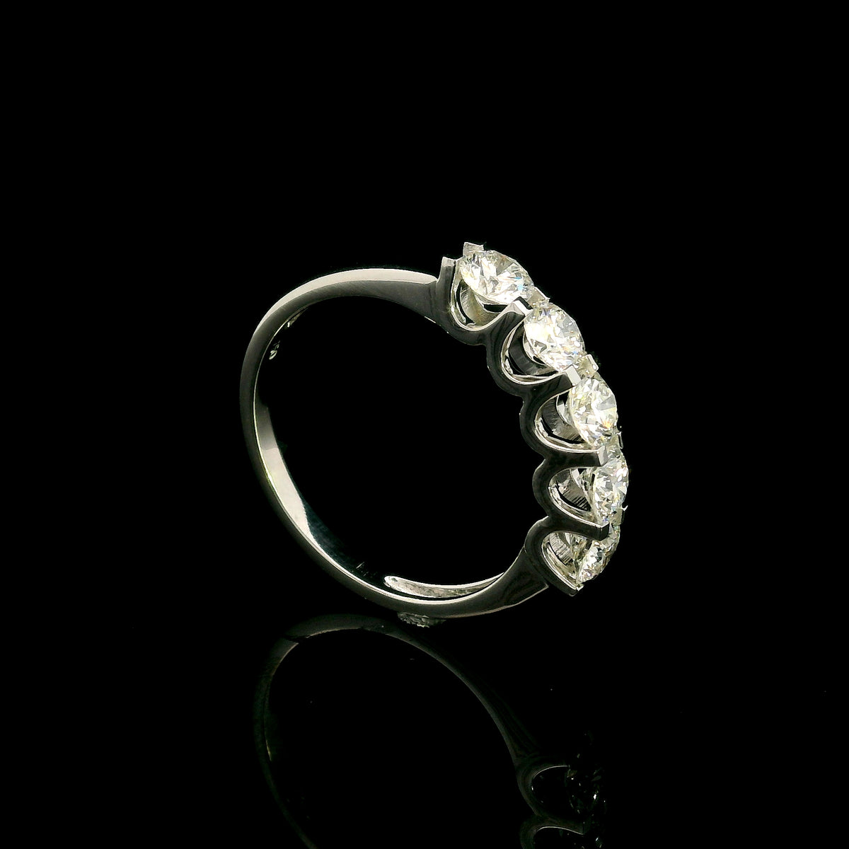Five stone diamond band ring in 18K white gold with round brilliant diamonds set across the front