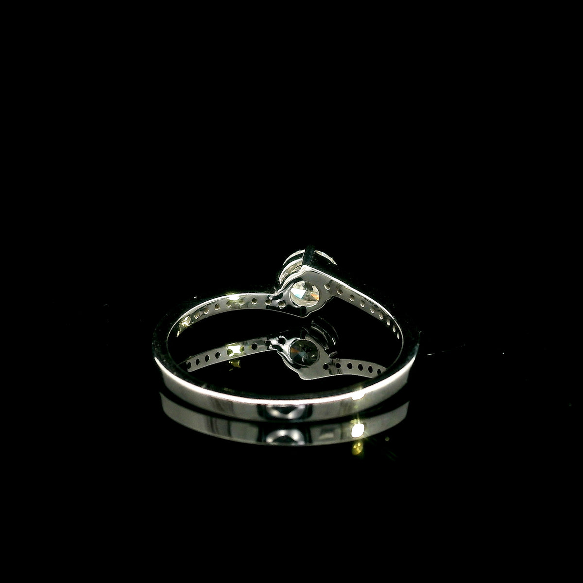 GIA certified round diamond engagement ring in 18K white gold with curved diamond band