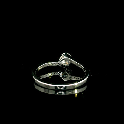 GIA certified round diamond engagement ring in 18K white gold with curved diamond band